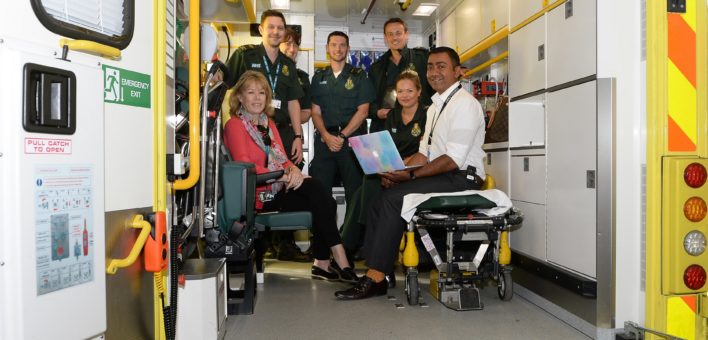 Photograph of the stroke team in the back of an ambulance