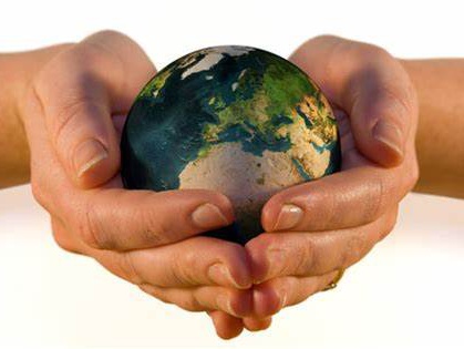 Generic photograph of hands holding a green Earth