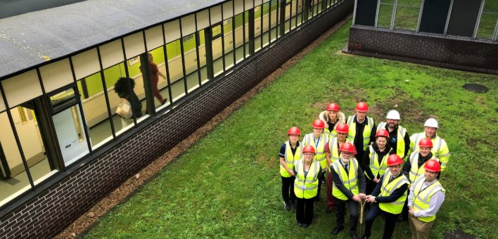 Photograph of Estates staff turf cutting at Colchester Hospital