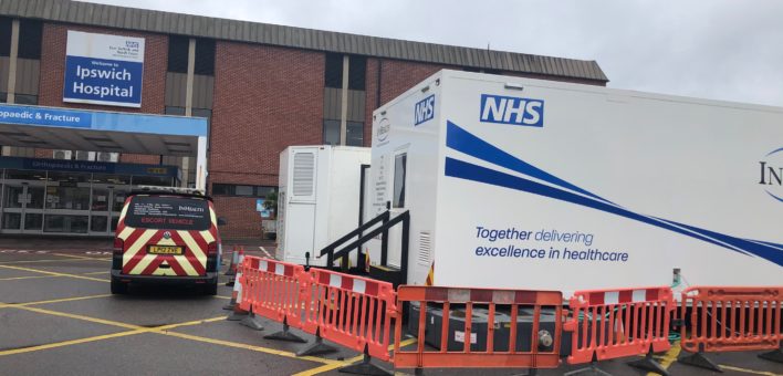 Photograph of 2 mobile treatment units outside the Trauma and Orthopaedic department of Ipswich Hospital