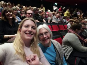 Two women in theatre taking a selfie