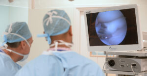 Two doctors looking at keyhole surgery