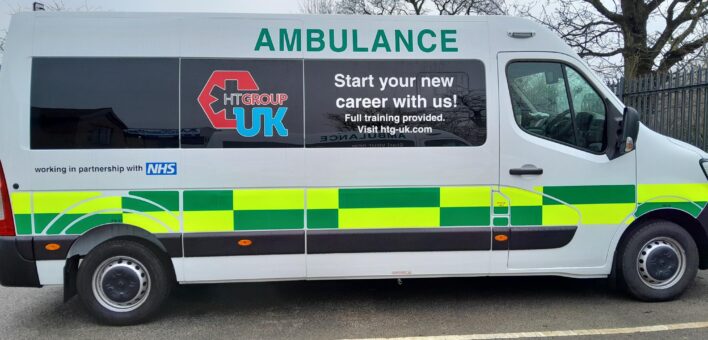 Photo of the side of a van with ambulance branding