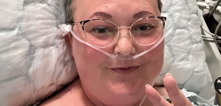 woman with nose tube in hospital bed